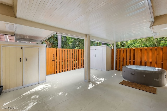 view of patio / terrace with a storage shed