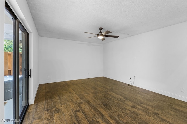 unfurnished room featuring a textured ceiling, dark hardwood / wood-style floors, and ceiling fan