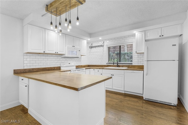 kitchen featuring white cabinets, white appliances, a textured ceiling, and sink