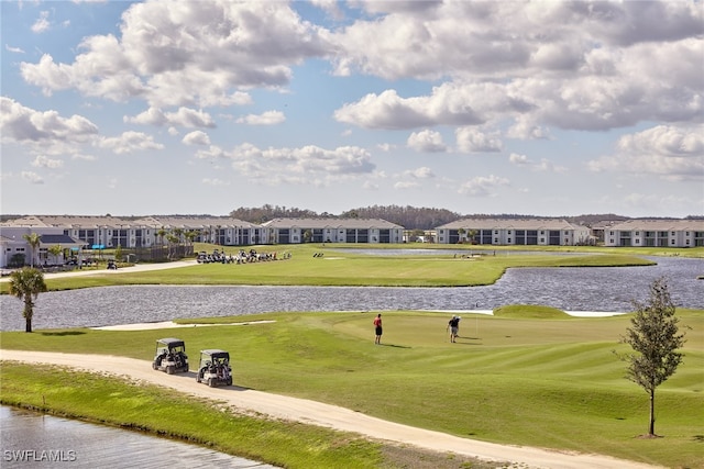 surrounding community featuring a yard and a water view