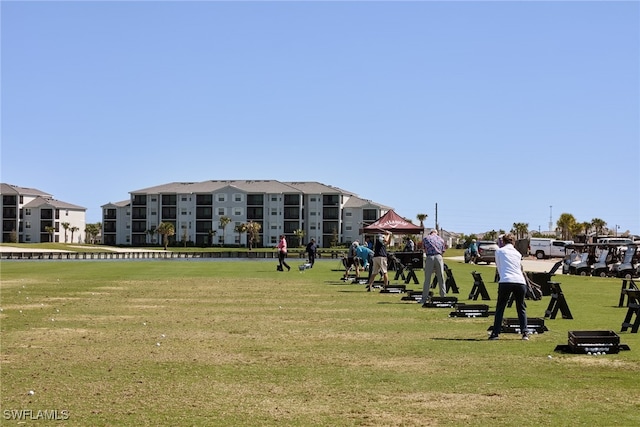 surrounding community featuring a yard