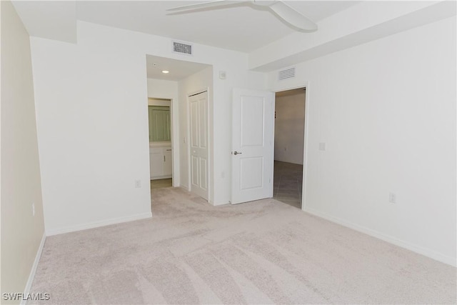 carpeted empty room with ceiling fan