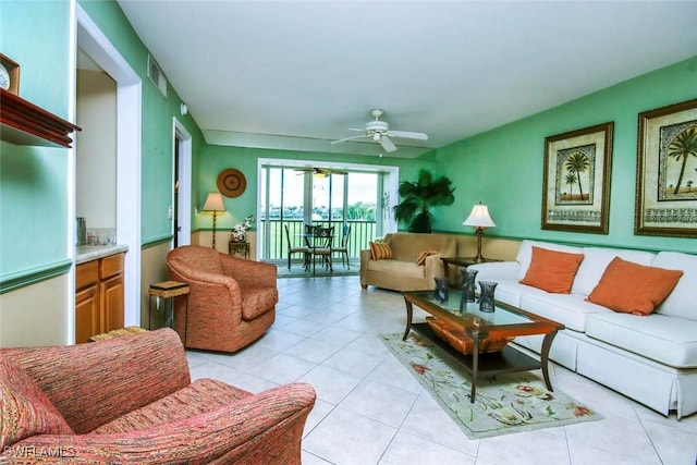 tiled living room with ceiling fan