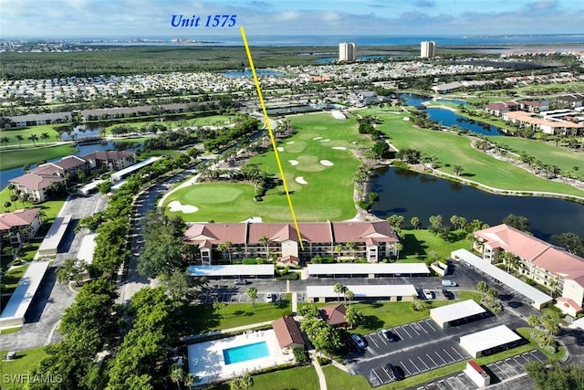 birds eye view of property featuring golf course view and a water view