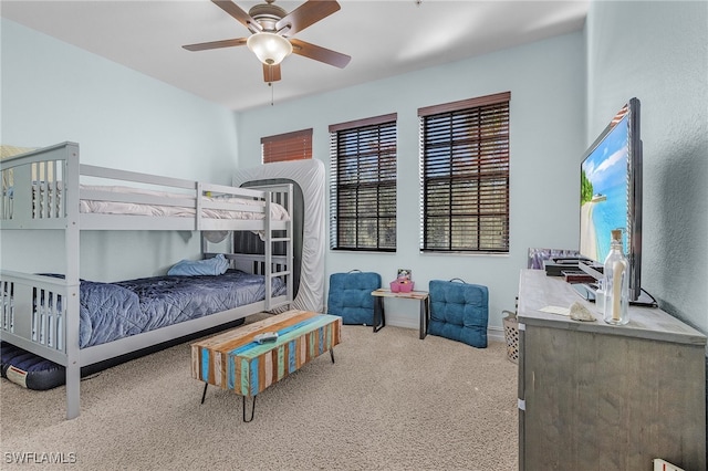 carpeted bedroom featuring ceiling fan