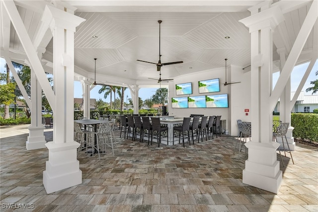 view of patio / terrace featuring a gazebo, an outdoor bar, and ceiling fan