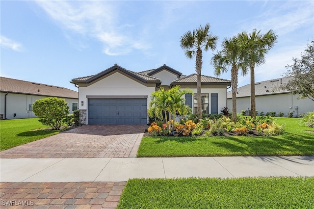 view of front facade with a garage and a front yard