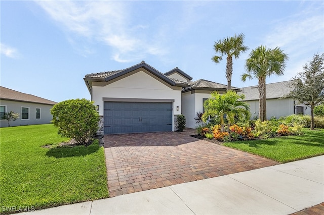 view of front of house with a garage and a front lawn