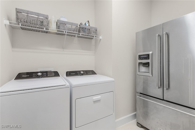 washroom with independent washer and dryer