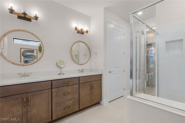 bathroom with tile patterned flooring, vanity, and an enclosed shower