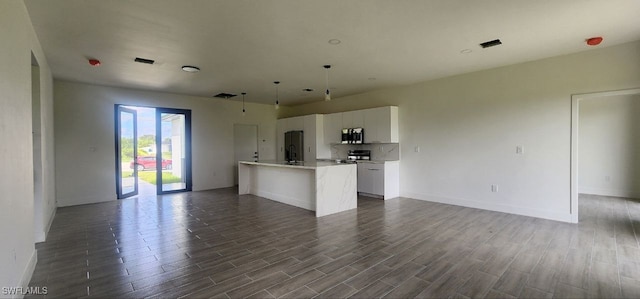 unfurnished living room with wood-type flooring