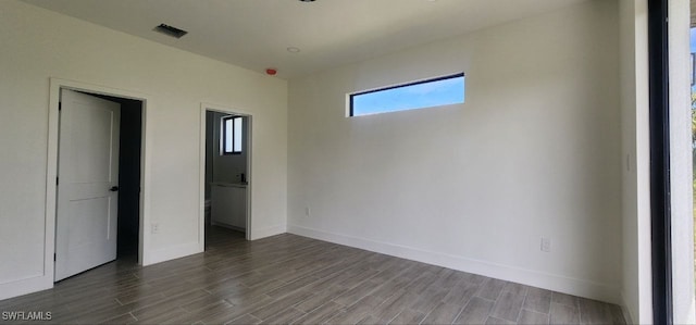 empty room with hardwood / wood-style floors