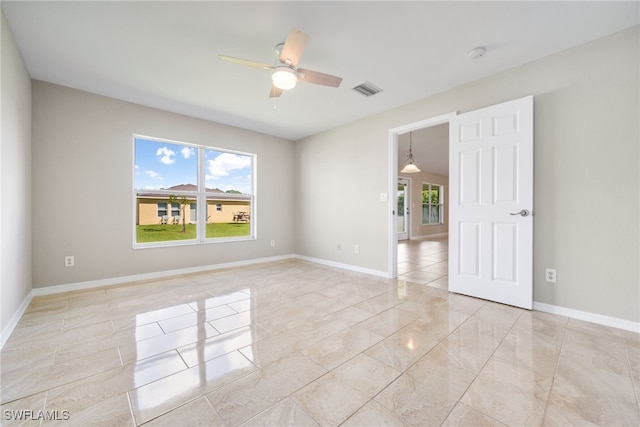 spare room featuring ceiling fan