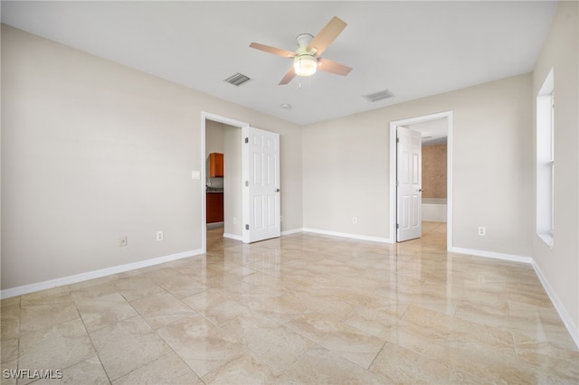 spare room with ceiling fan