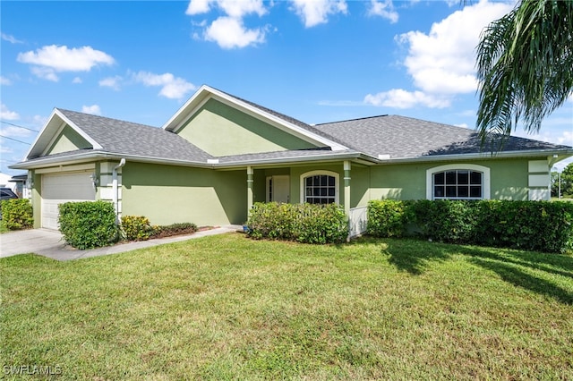 view of front of home featuring a front yard and a garage