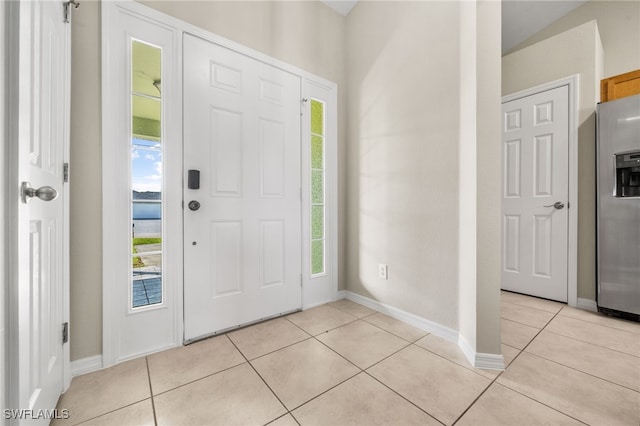 entryway featuring light tile patterned flooring