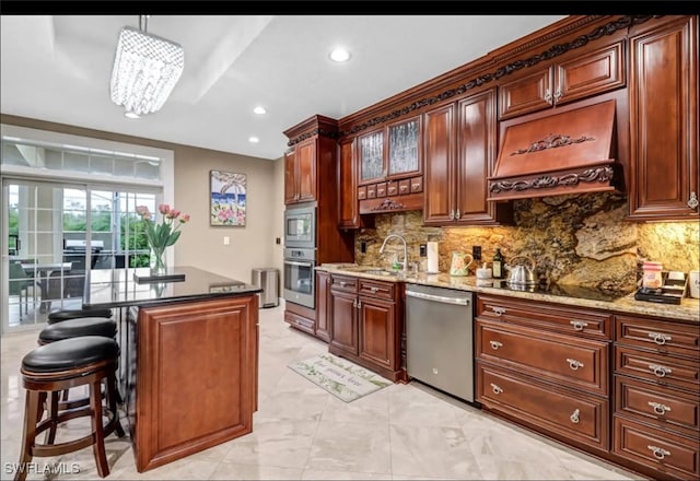 kitchen with custom exhaust hood, an inviting chandelier, backsplash, appliances with stainless steel finishes, and decorative light fixtures