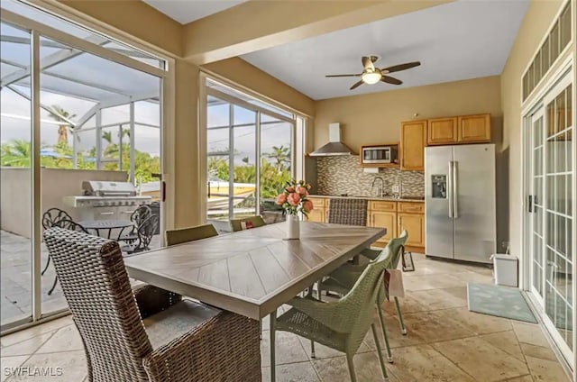 interior space with ceiling fan