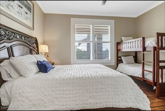 bedroom featuring ceiling fan and dark hardwood / wood-style floors