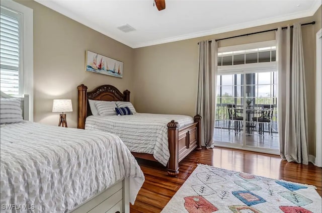 bedroom featuring multiple windows, access to outside, ceiling fan, and dark wood-type flooring