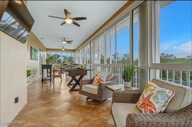 sunroom with ceiling fan and a healthy amount of sunlight