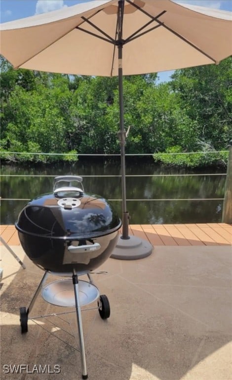 view of patio featuring a water view