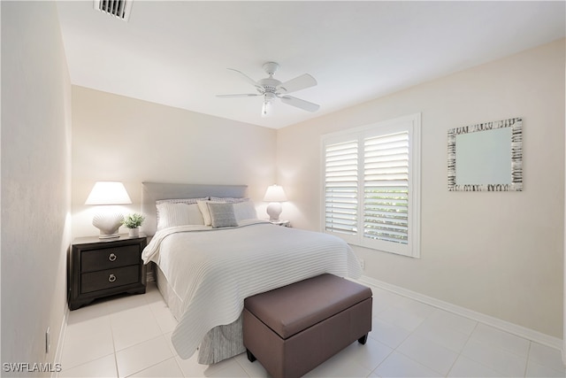 bedroom with ceiling fan and light tile patterned floors