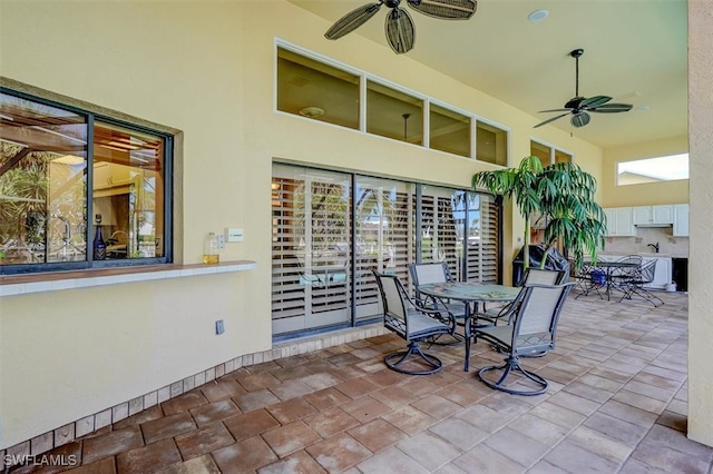 view of patio / terrace featuring ceiling fan