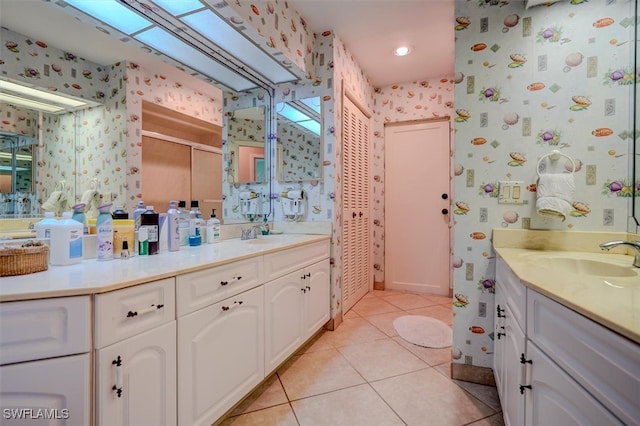 bathroom with vanity, tile patterned flooring, and a shower with door