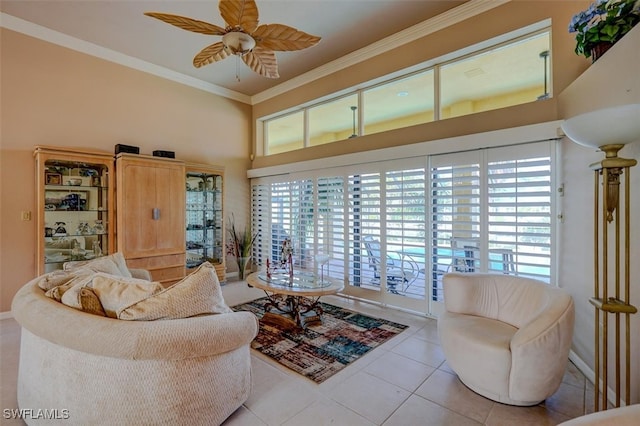 living room with ceiling fan, ornamental molding, plenty of natural light, and light tile patterned floors