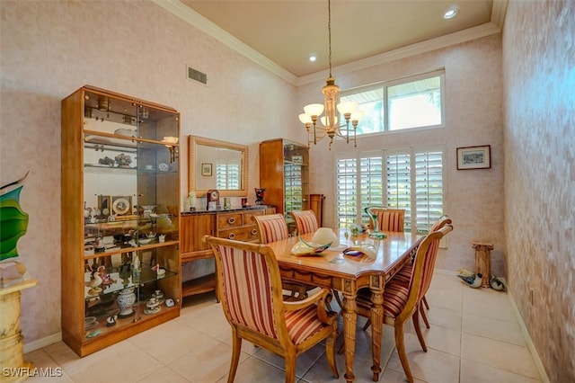 dining area featuring light tile patterned flooring, a towering ceiling, and crown molding