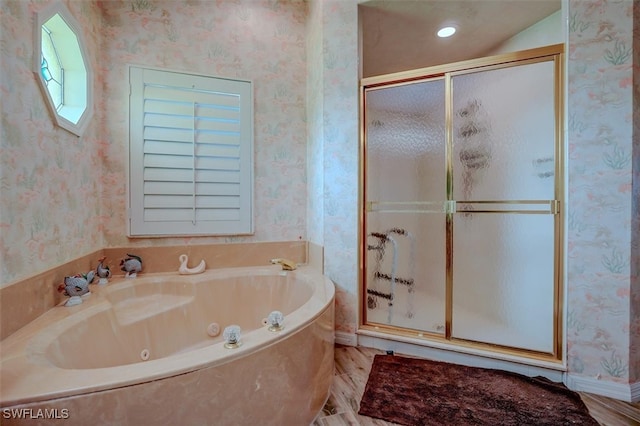 bathroom featuring wood-type flooring and plus walk in shower