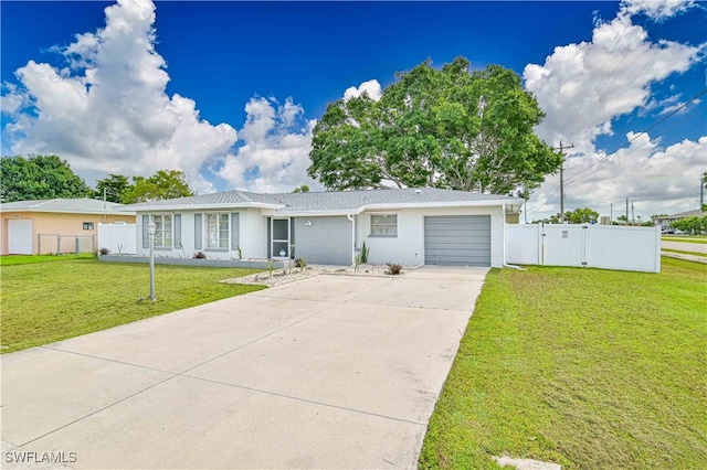 ranch-style house with a garage and a front lawn