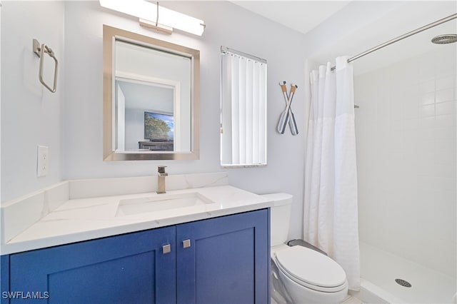 bathroom with vanity, toilet, and a shower with shower curtain