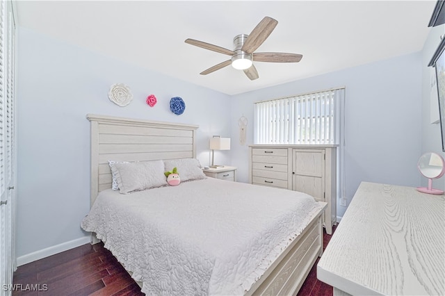 bedroom with ceiling fan and dark wood-type flooring