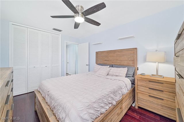 bedroom featuring a closet, ceiling fan, and dark hardwood / wood-style flooring