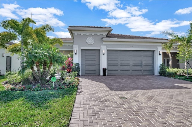 mediterranean / spanish home featuring a garage