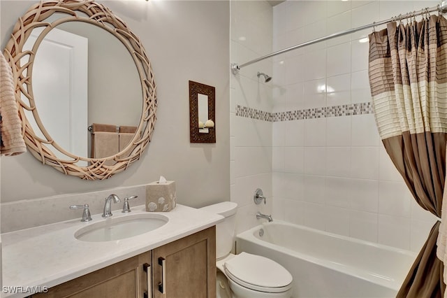 full bathroom with shower / bath combo, vanity, and toilet