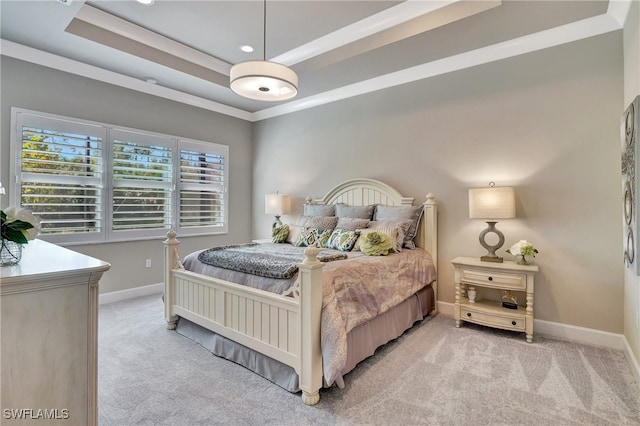 bedroom with light carpet, a raised ceiling, and ornamental molding