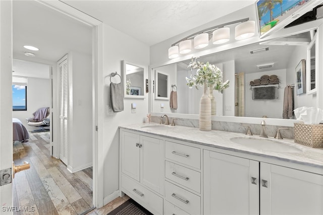 bathroom featuring wood-type flooring and vanity