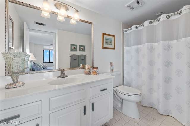 bathroom featuring a shower with shower curtain, tile patterned floors, vanity, and toilet