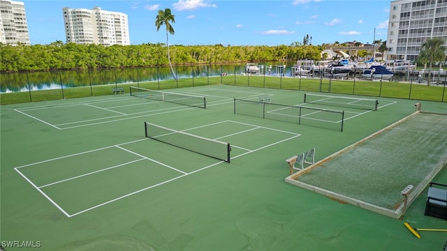 view of sport court featuring a water view