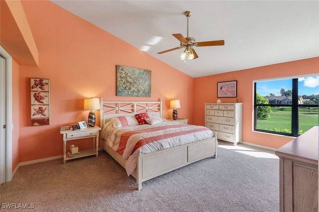 bedroom featuring light colored carpet, vaulted ceiling, and ceiling fan