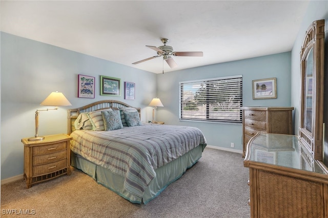 bedroom with ceiling fan and carpet floors