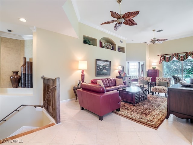 living room with crown molding, light tile patterned flooring, and ceiling fan