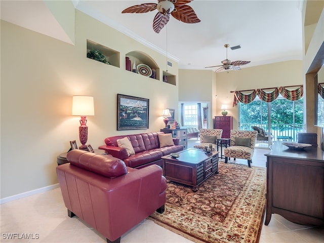 living room featuring crown molding, light tile patterned flooring, and ceiling fan