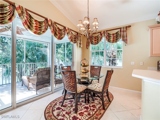 dining area featuring vaulted ceiling, light tile patterned flooring, a chandelier, and ornamental molding