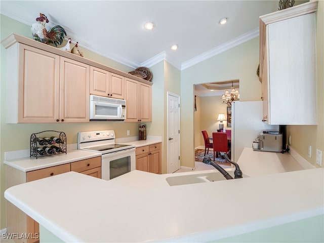 kitchen featuring white appliances, kitchen peninsula, light brown cabinets, ornamental molding, and sink