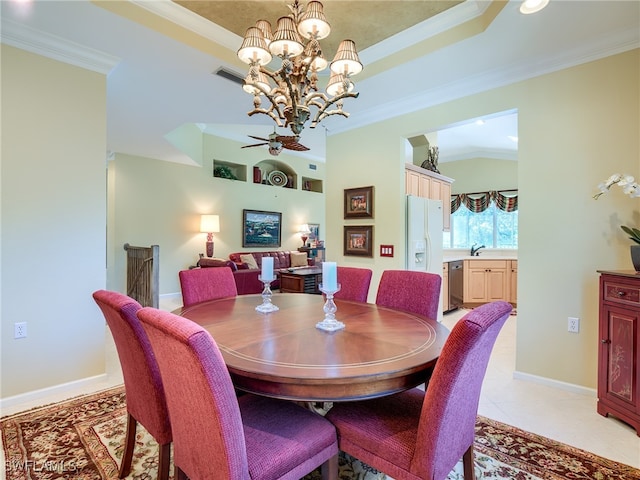 dining area with ceiling fan with notable chandelier, ornamental molding, sink, and light tile patterned floors