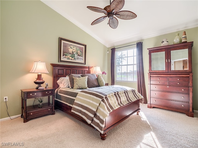 bedroom featuring ceiling fan, ornamental molding, light carpet, and vaulted ceiling